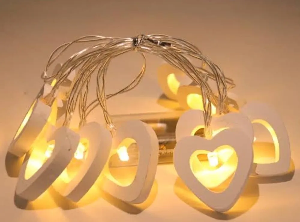Unique proposal decoration ideas with heart shape string lights at home